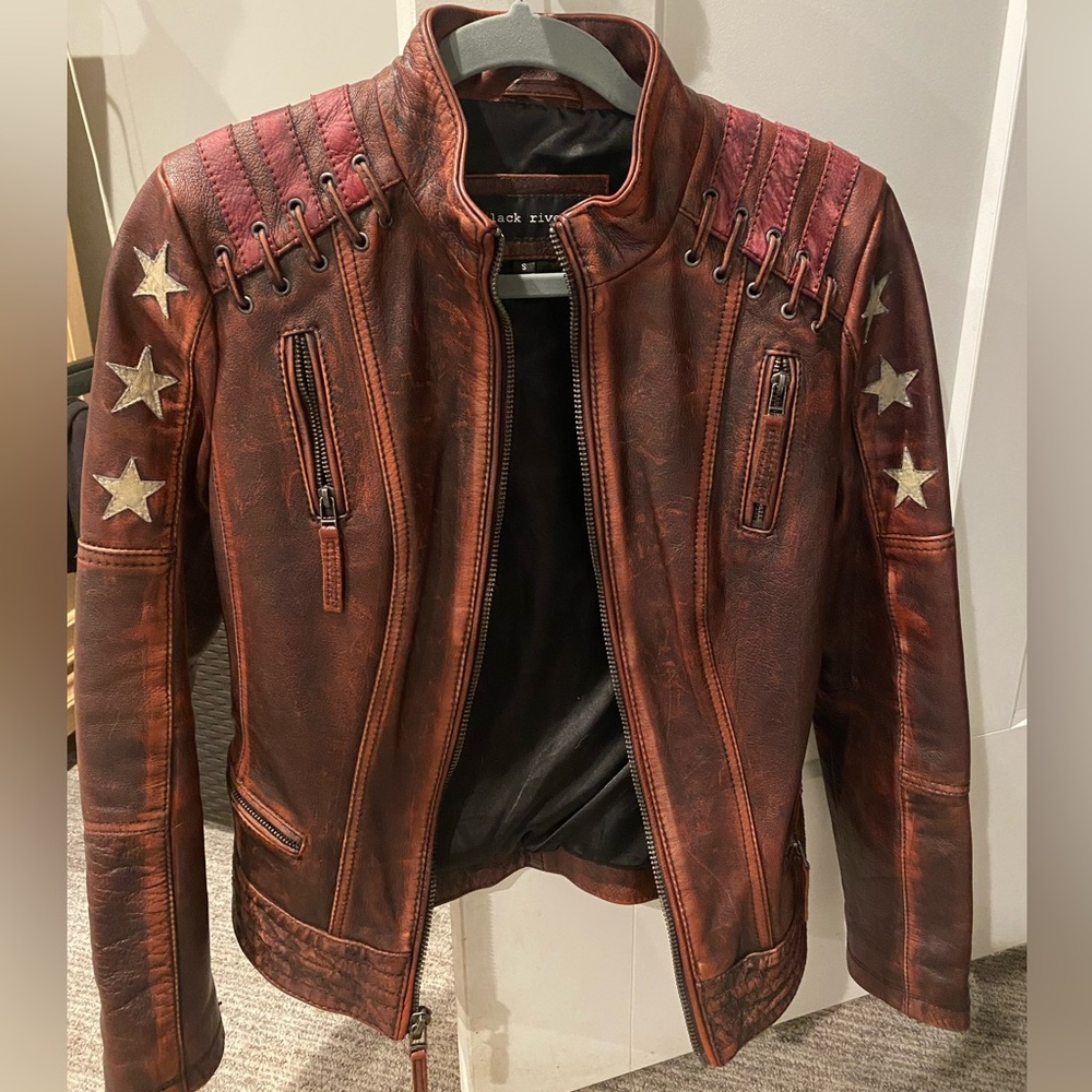 Wilsons/Black Rivet Leather Jacket Women's Sz Small Stars/Stripes. Never worn.